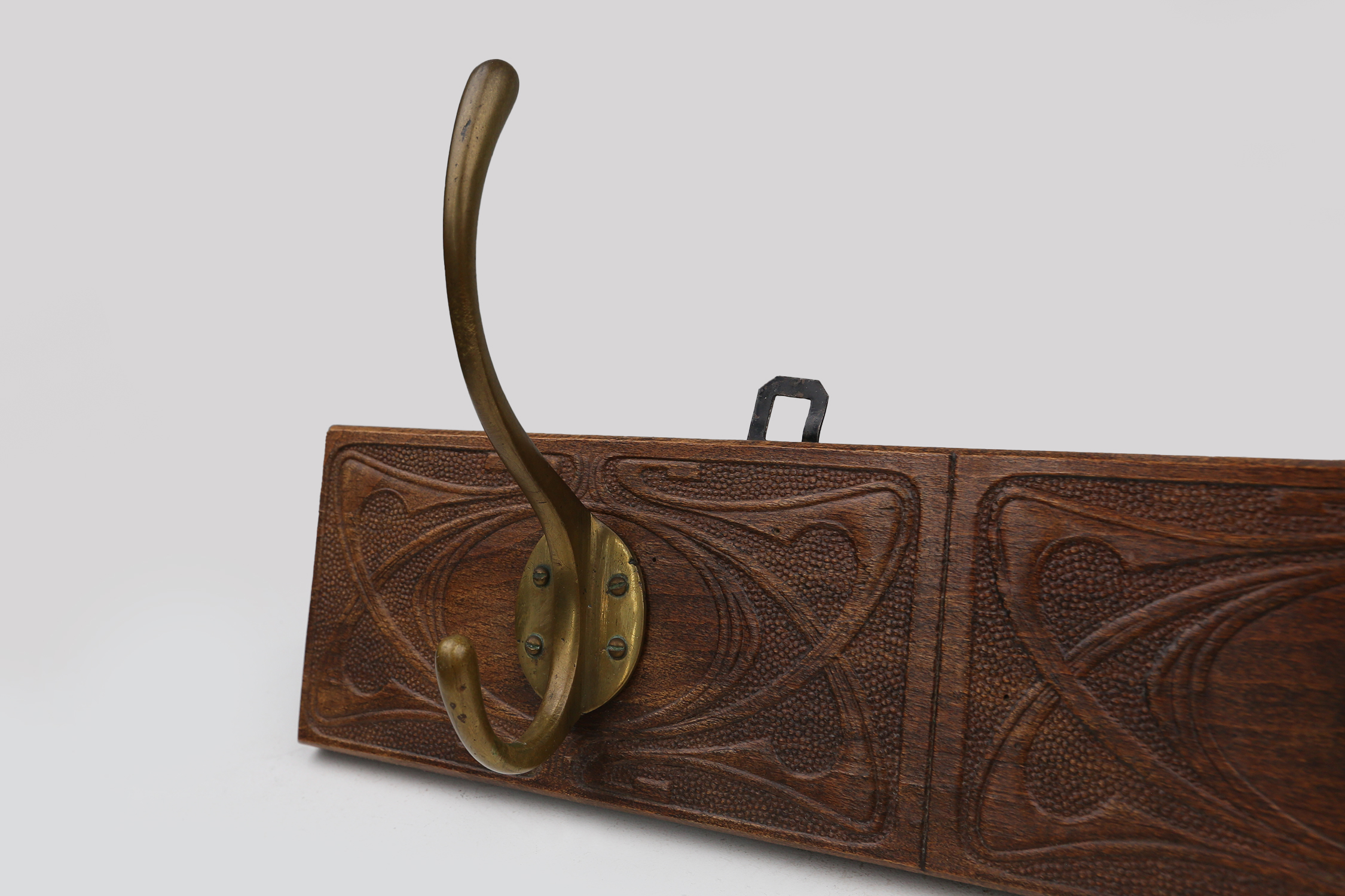 Art Nouveau wall coat rack in carved wood with brass, France ca. 1910thumbnail